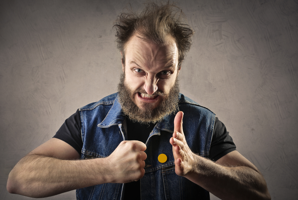 Four angry man. Evil guy photo. Guy punching someone stock image.